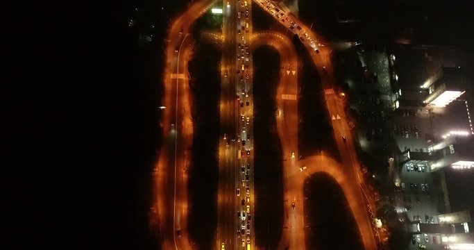 4K Aerial Top Drone View: Accident and traffic jam on the bridge in the evening after a working day. A huge number of cars on the road at rush hour. Downtown, city central part. Camera looks down.