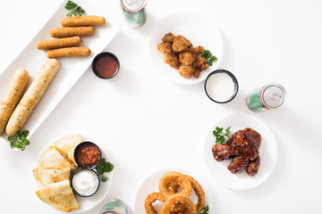 Buffalo wings, onion rings, quesadillas, mozzarella sticks, breadsticks, and chicken nugget appetizer spread