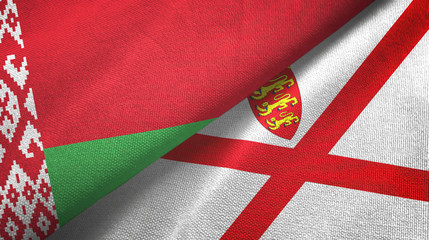 Obraz premium Belarus and Jersey two flags textile cloth, fabric texture