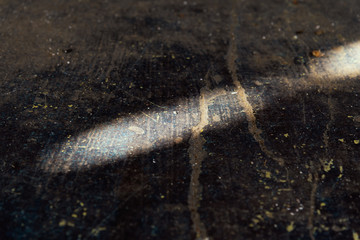 Close up of abstract light and shadow on a grunge background.