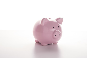 Pink pig piggy bank on a white background.