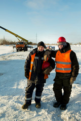 Two workers at the site of the ice camp