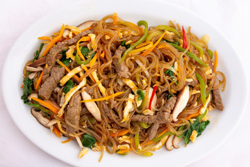 Stir fried Korean glass noodle with soy sauce called Japchae