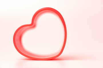 Heart. Red heart on a white background. Toy the shape of a heart. Valentine's day, February 14.