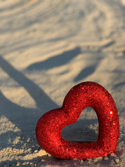 Red heart on the beach