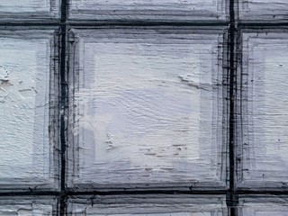 Intricate squares painted on coarse plywood