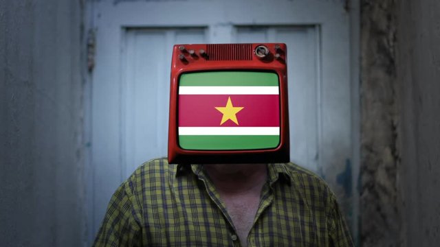 Man Television with the Flag of Suriname on the Screen. Zoom In.