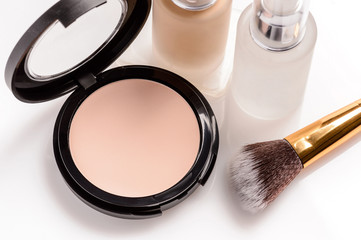 Set of cosmetics for makeup on a white background