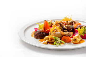 Chicken with mushrooms and grilled vegetables. Close up.