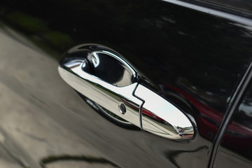 Obraz na płótnie Canvas vehicle part of door handle on black modern car
