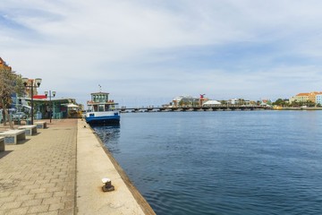 Beautiful view of coast line of Willemstad. Dark blue water surface of Atlantic ocean. Coast line...
