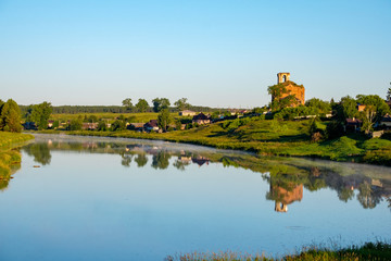 Fototapeta na wymiar rural landscape of Central Russia river and dilapidated Church on the Bank