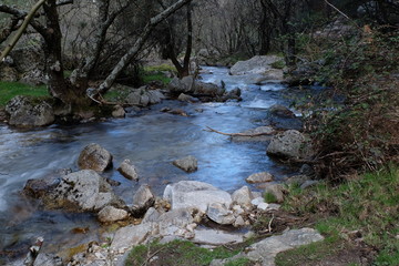 Mountain landscape with river in beautiful green, brown and blue colors, Lozoya Valley, Madrid, Spain
