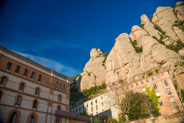 BARCELONA, SPAIN - December 26, 2018: The mountains and buildings of Montserrat in Barcelona, Spain. Montserrat  is a Spanish shaped mountain which influenced Antoni Gaudi to make his art works.