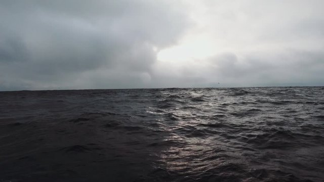 Placid sea with an incoming storm