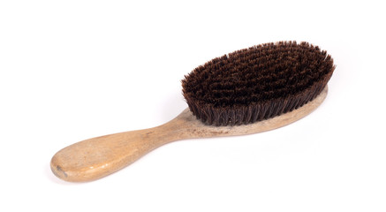 Old hair brush with some hair in it
