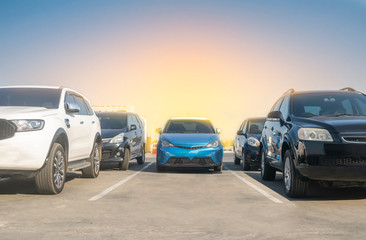 Obraz na płótnie Canvas Car parked in asphalt parking lot and empty space parking with blue sky background.