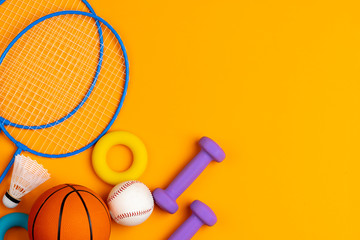 Assortment of sport equipment on yellow background, top view © fotofabrika