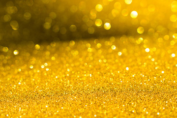 sparkles of golden glitter texture background