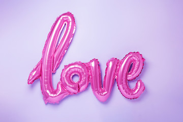 Balloons in the form of word Love in trendy neon colours. Valentines day celebration.