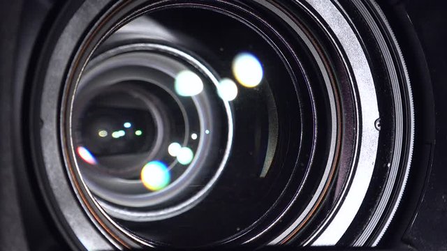Process of zooming  camcorder lens, Close-up of a camcorder lens