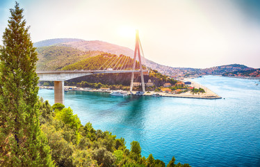 Panorama of impressive Franjo Tudjman bridge and blue lagoon with harbor of Dubrovnik