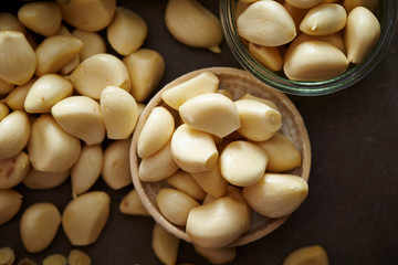 Peeled garlic background, studio shot 