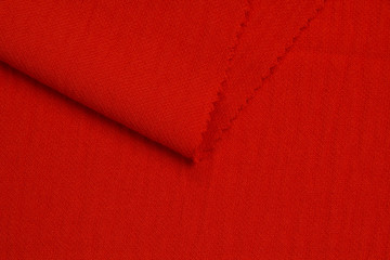 Fabric suit fold top view. Red textile