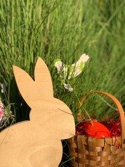 Easter bunny, basket and green grass
