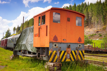 An old abandoned locomotive stands at a dead end.