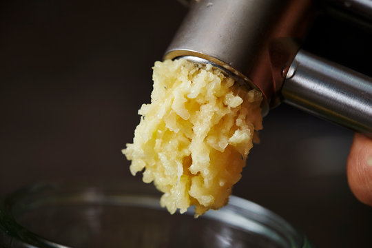 Garlic crusher, crushing garlic clove