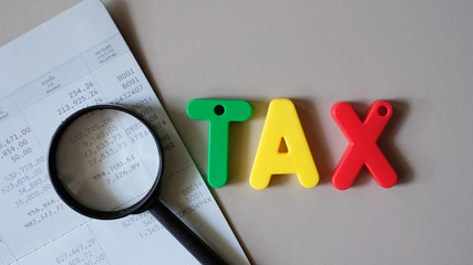 Word TAX with copy space using as background business financial, saving money.