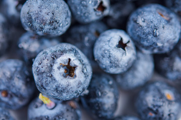Blueberries floating in water with bubbles. Fresh blueberries background with copy space for your text.