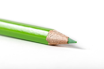 close up macro shot of colorful pencils on white background