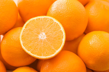 Many tasty oranges as background
