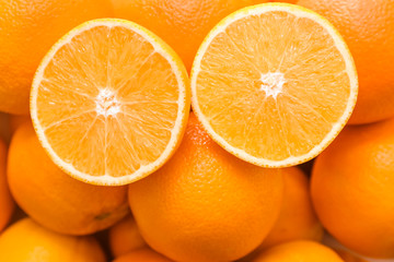 Many tasty oranges as background