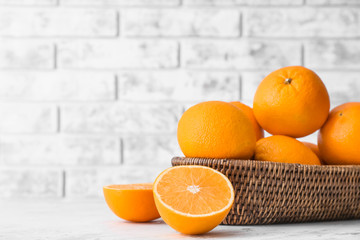 Sweet tasty oranges on table
