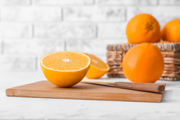 Sweet tasty oranges on table