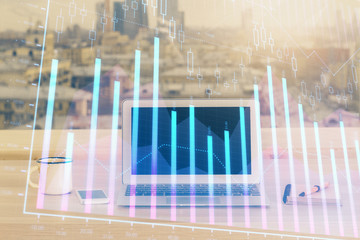 Financial market graph hologram and personal computer on background. Double exposure. Concept of forex.