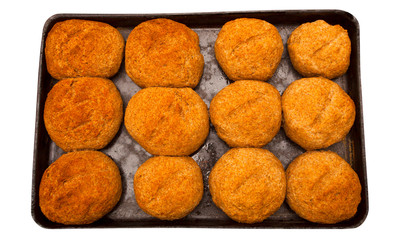 baked buns in a pan isolated on white