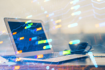 Double exposure of desktop computer and technology theme hologram. Concept of software development.