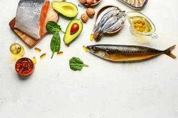 Set of healthy products with high omega 3 and fish oil pills on white background