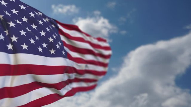 Waving 3D render realistic 4K American flag in cloudy sky. Strong depth of field creates large copy space. Loopable video, duration can be adjust.