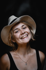 portrait of a young smiling girl with blond short hair and a hat - 316954404