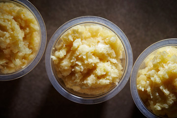 Crushed garlic in plastic bowl 