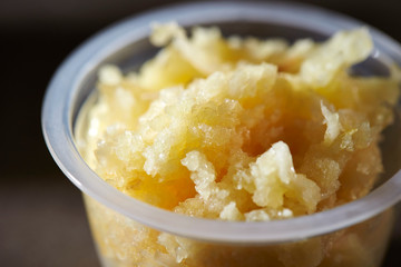 Crushed garlic in plastic bowl 
