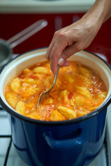 Cooking a soup with dumplings