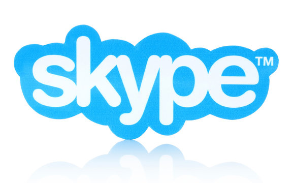 KIEV, UKRAINE - JANUARY 19, 2015: Skype logotype printed on paper and placed on white background. Skype is a telecommunications application software developed by Microsoft.
