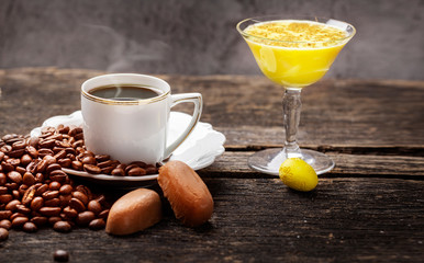 Coffee and eggnog, decoration for easter on dark wooden table