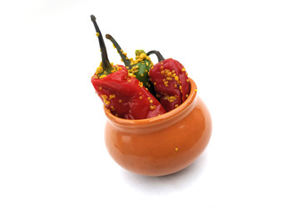 fresh green and red chilli pickle put in a bowl isolated on white background